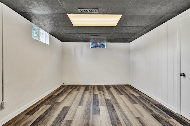 basement featuring hardwood / wood-style floors