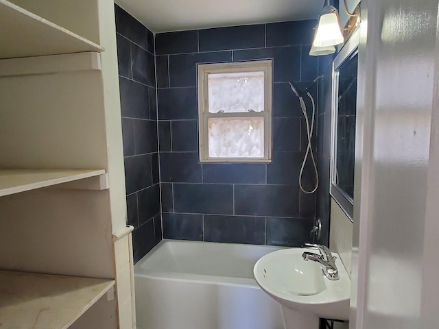 bathroom featuring bathtub / shower combination and a sink