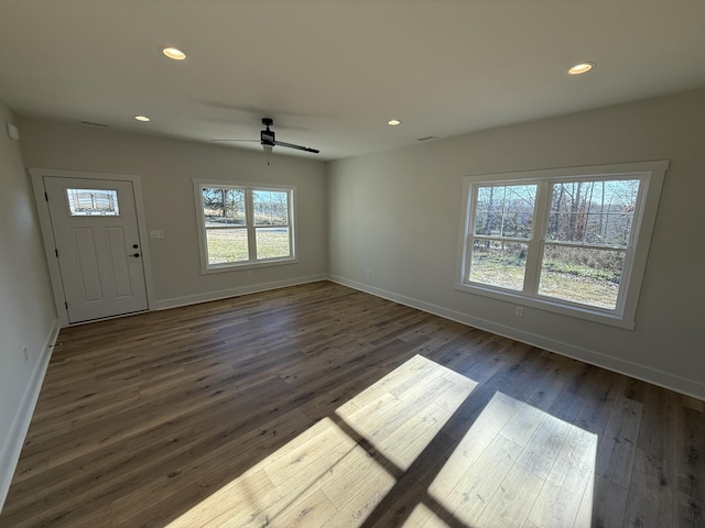 interior space featuring ceiling fan and dark hardwood / wood-style flooring