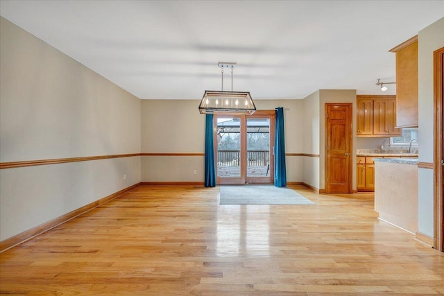 unfurnished dining area featuring light hardwood / wood-style floors