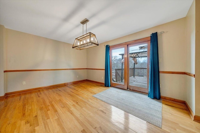 unfurnished room with light hardwood / wood-style floors