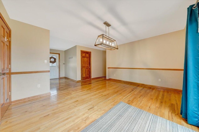 spare room with light wood-type flooring