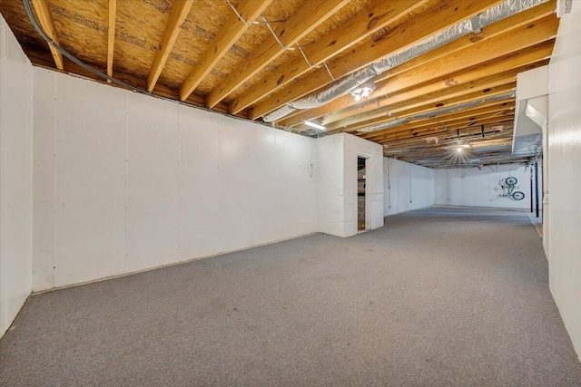 basement with carpet flooring