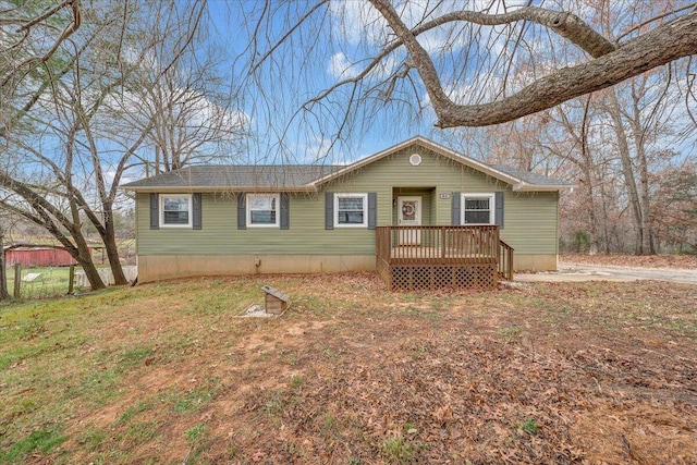 view of front of house with a wooden deck