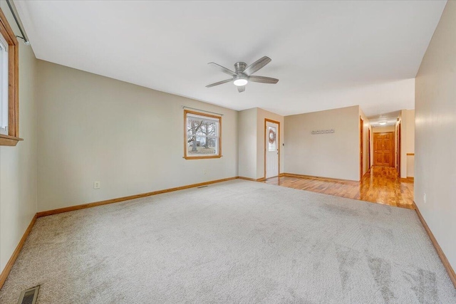 unfurnished room with ceiling fan and light hardwood / wood-style flooring