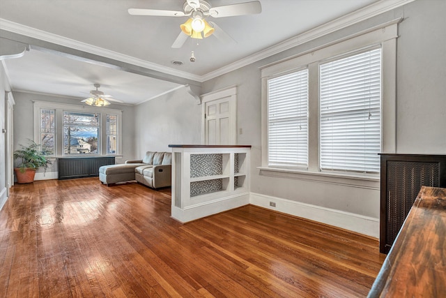 interior space featuring hardwood / wood-style flooring, plenty of natural light, ornamental molding, and ceiling fan