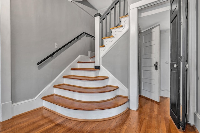 stairway featuring hardwood / wood-style flooring