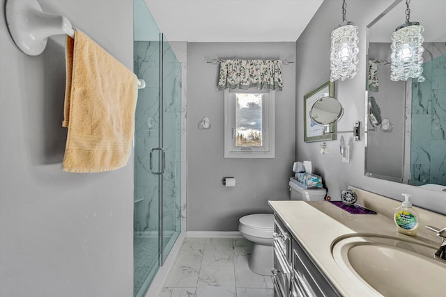 bathroom with a shower with door, vanity, and toilet