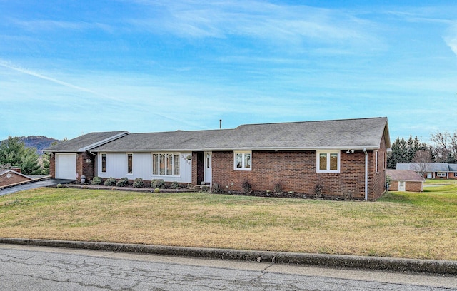 ranch-style house with a garage and a front yard