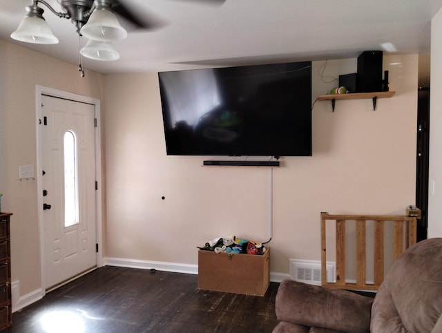 foyer with dark hardwood / wood-style floors and ceiling fan