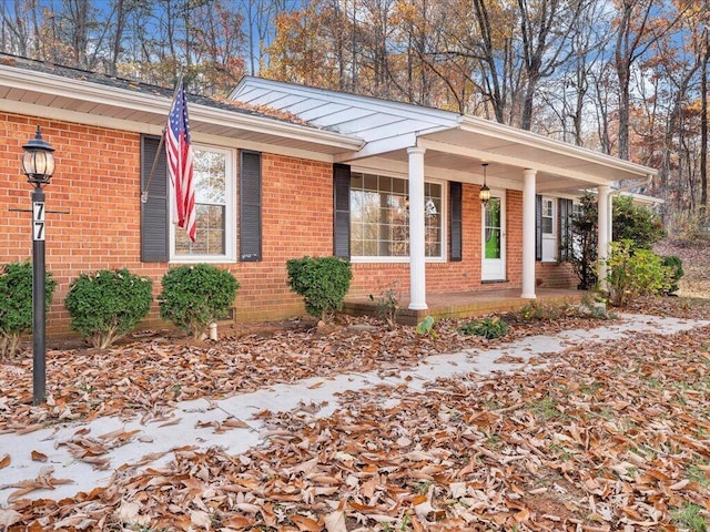 view of property exterior with covered porch