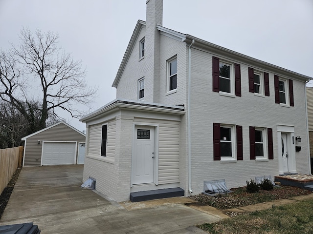 view of front facade featuring an outbuilding and a garage