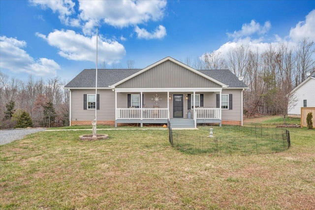 view of front facade featuring covered porch and a front yard