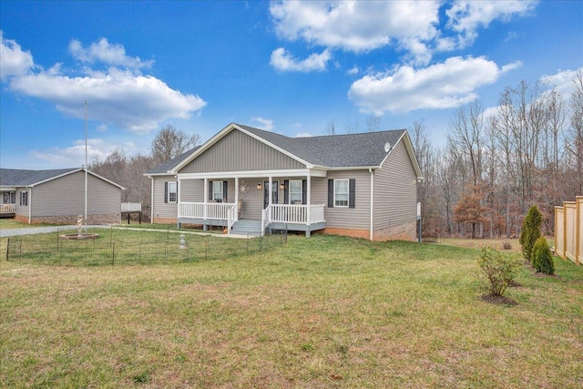 view of front of house with covered porch and a front yard