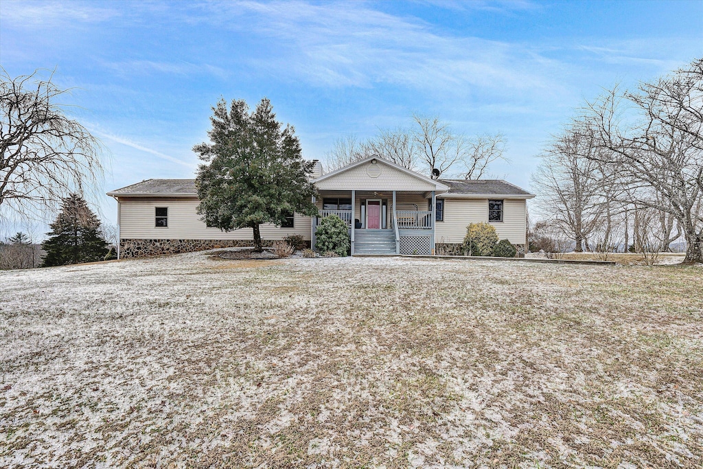 single story home featuring covered porch