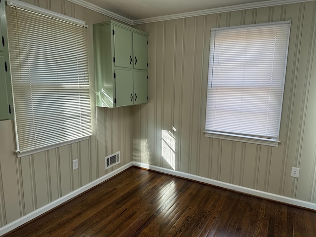 unfurnished room featuring crown molding and dark hardwood / wood-style flooring