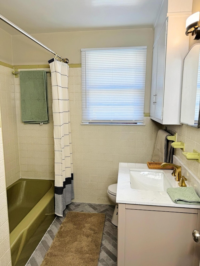 full bathroom featuring toilet, wood-type flooring, tile walls, and shower / tub combo