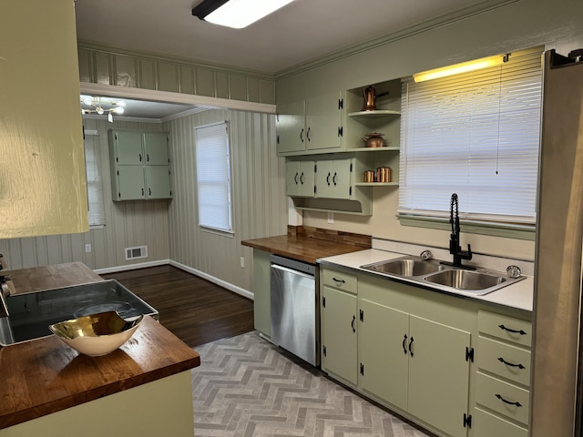 kitchen featuring wooden counters, crown molding, sink, dishwasher, and light hardwood / wood-style floors