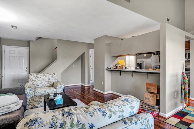 living room with dark hardwood / wood-style floors