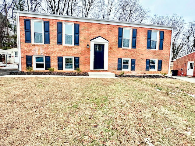 raised ranch with a front lawn