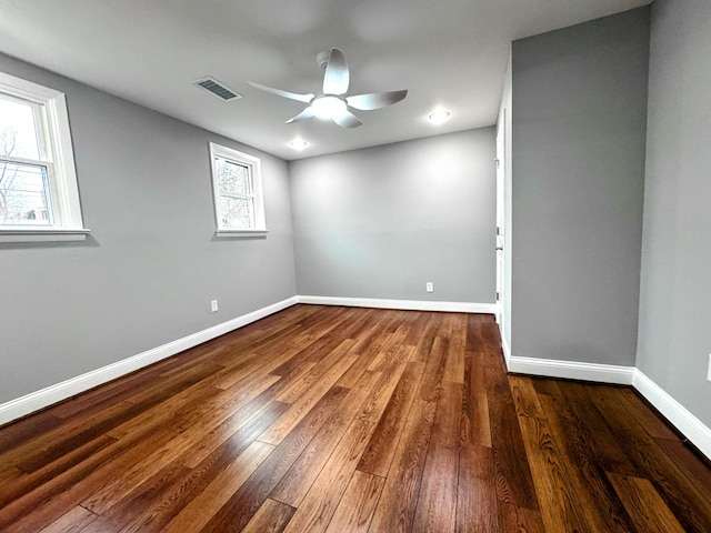 empty room featuring dark hardwood / wood-style floors and ceiling fan