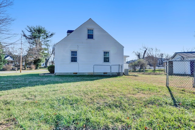 view of home's exterior featuring a lawn and central AC unit