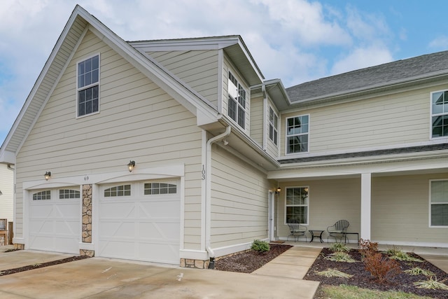 view of front of house with a porch and a garage