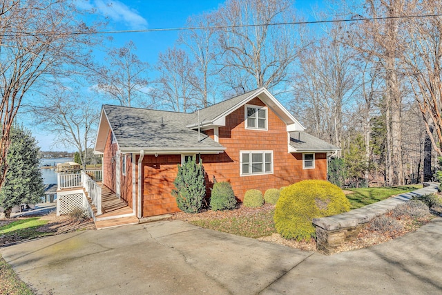 view of side of home with a deck