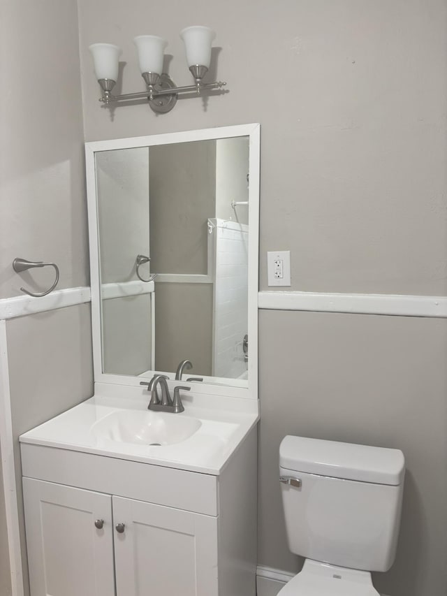 bathroom featuring vanity and toilet