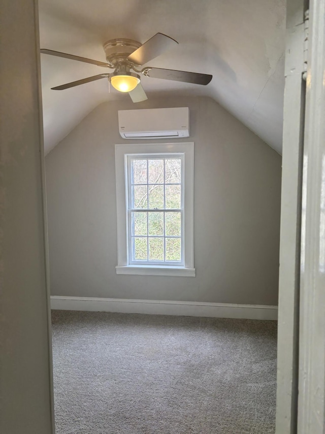 bonus room with carpet flooring, ceiling fan, lofted ceiling, and a wall unit AC