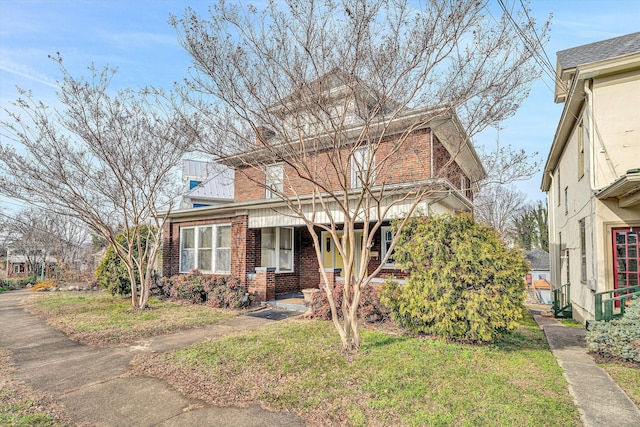 view of front of house with a front lawn and covered porch