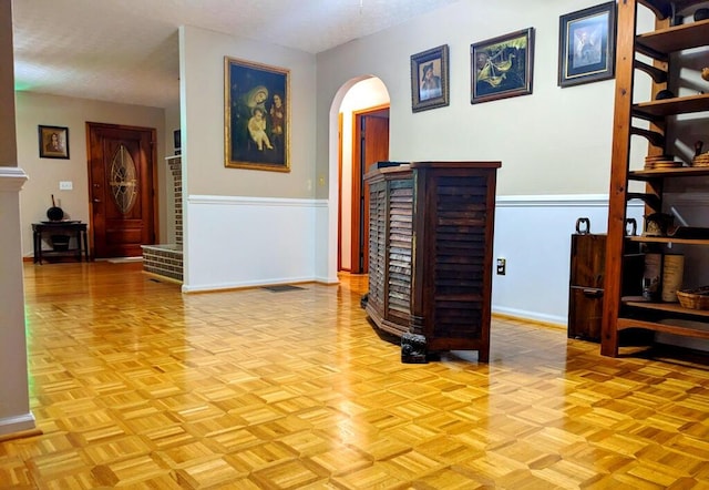 corridor featuring light parquet flooring