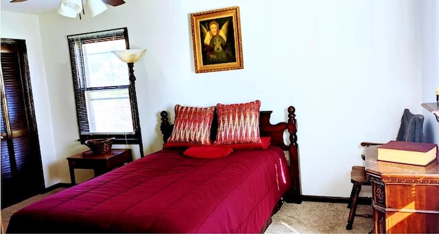 carpeted bedroom featuring ceiling fan