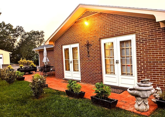 rear view of property with a patio and french doors