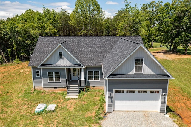 view of front facade with a porch, a garage, and a front yard