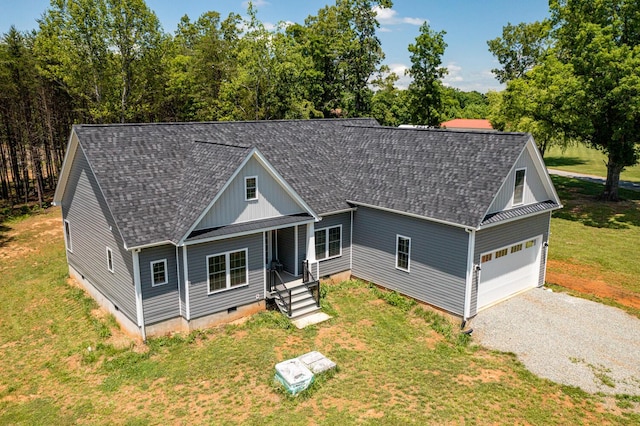 view of front of property with a front lawn and a garage