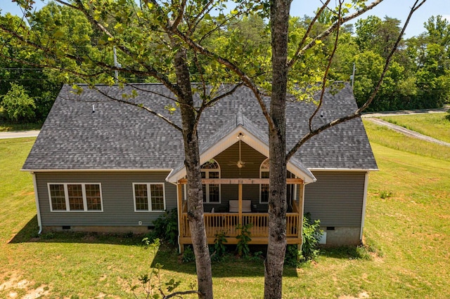 rear view of house with a yard