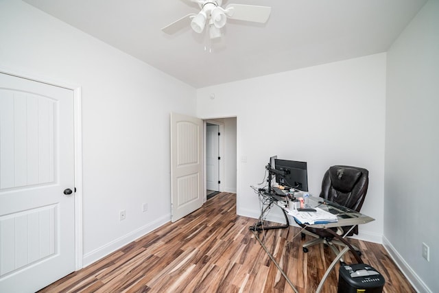 office space with dark hardwood / wood-style flooring and ceiling fan