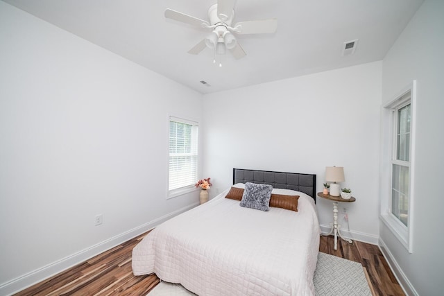 bedroom featuring ceiling fan and dark hardwood / wood-style floors