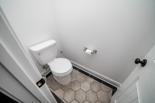 bathroom featuring tile patterned flooring and toilet