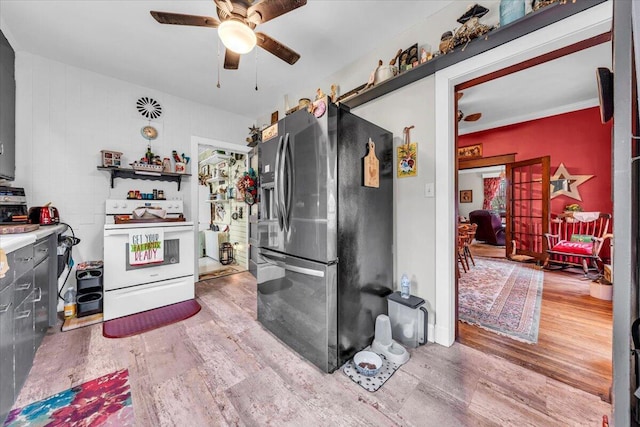 kitchen with stainless steel fridge with ice dispenser, hardwood / wood-style flooring, white range with electric stovetop, and ceiling fan