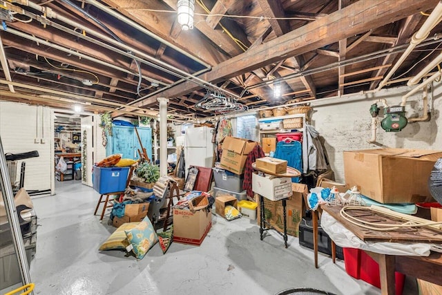 basement featuring white refrigerator