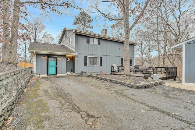 back of property with a wooden deck