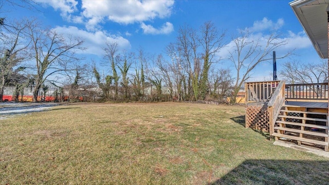 view of yard featuring stairway and a wooden deck