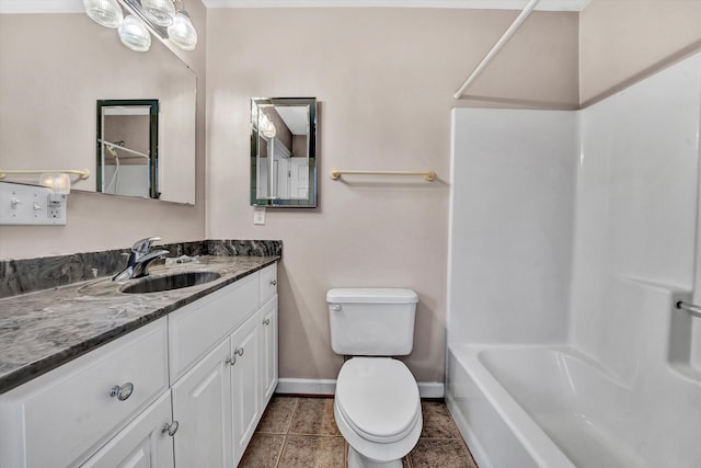 full bathroom with tile patterned floors, vanity, toilet, and shower / washtub combination