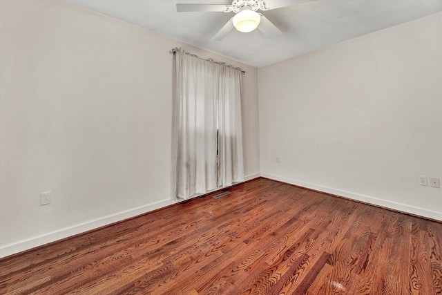 spare room with ceiling fan and wood-type flooring