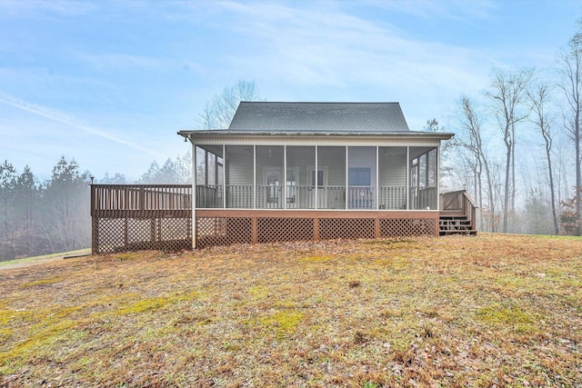 back of property featuring a sunroom