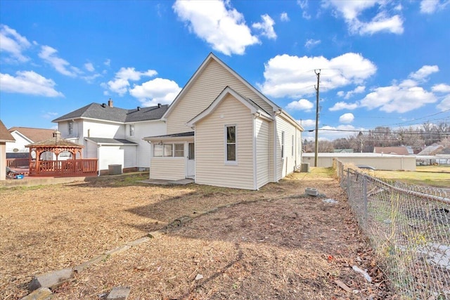 rear view of property with a gazebo