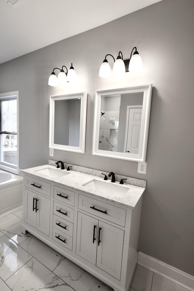 bathroom with a bathing tub and vanity