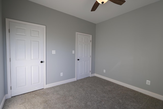 unfurnished bedroom featuring carpet floors and ceiling fan